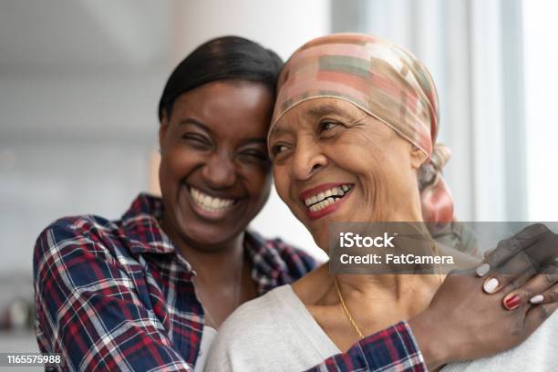 Courageous Woman With Cancer Spends Precious Time With Adult Daughter Stock Photo - Download Image Now
