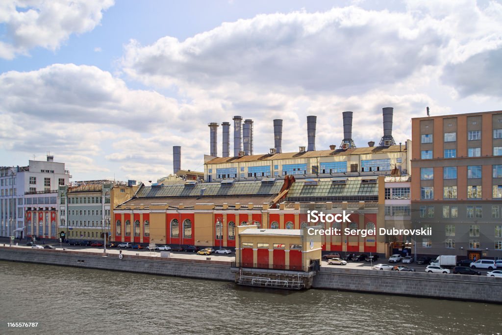 Moscow River, Raushskaya Embankment, Moscow. GES-1 (Raushskaya Power Station) Moscow River, Raushskaya Embankment, Moscow. GES-1 (Raushskaya Power Station), oldest in Russia (1897). UNESCO. Movement pleasure boats, blue cloudy sky. No recognizable people Architecture Stock Photo