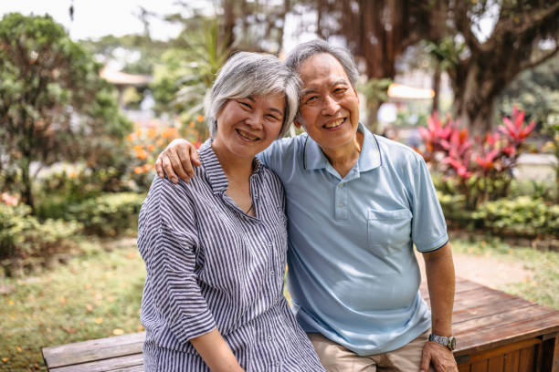 istock Senior couple hugging in park 1165578833