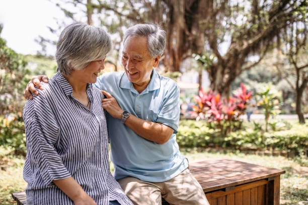 istock Senior couple hugging in park 1165578905