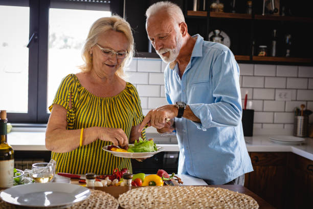 istock A senior couple cooks in the kitchen 1165583462