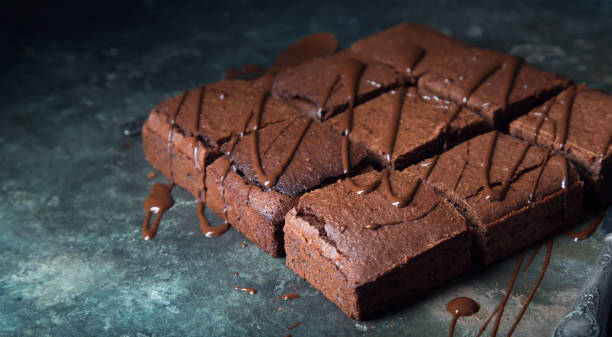 istock Brownie cake dessert. Dark sponge cake with cocoa and chocolate. 1165586893