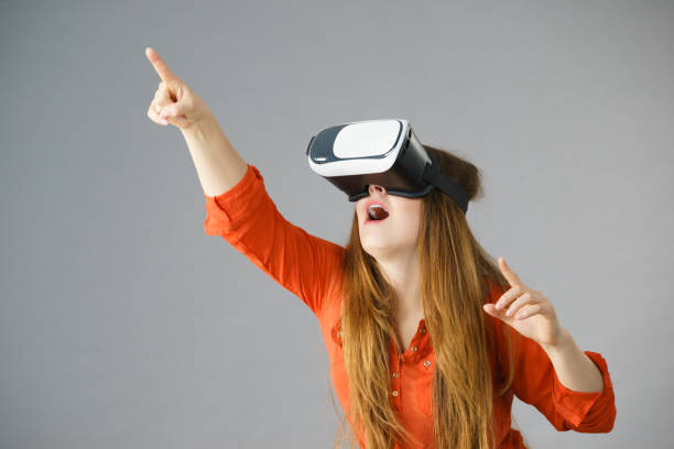 istock Girl wearing virtual reality goggles. 1165587459