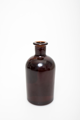 Empty bottle for drugs from brown glass