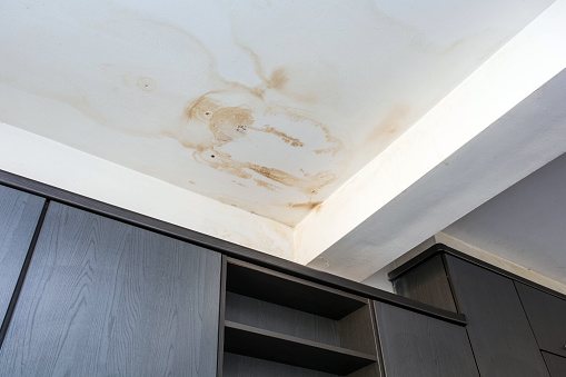 Roof leakage, water dameged ceiling roof and stain on ceiling close-up