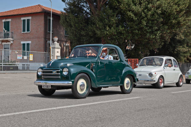 Vintage Fiat 500 C Transformable Mickey Mouse (c. 1950) Vintage Fiat 500 C Topolino Trasformabile (ca. 1950) in classic car rally 33st Raduno moto e auto d'epoca in Bagnara di Romagna, RA, Italy - July 29, 2018 fiat 500 topolino stock pictures, royalty-free photos & images