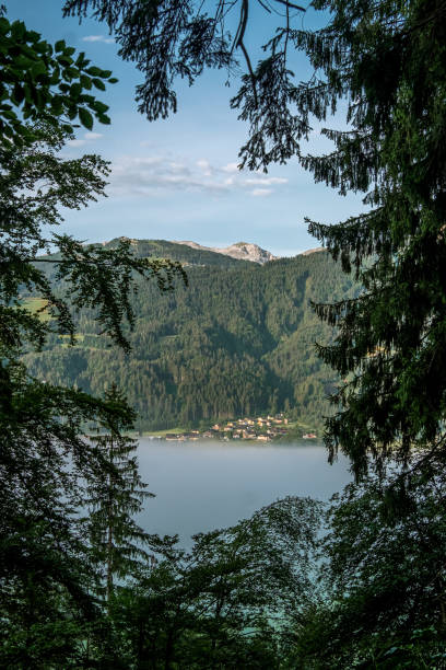 Village near a lake of mist stock photo