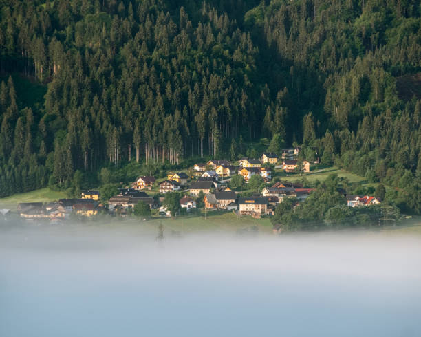 Village near a lake of mist stock photo