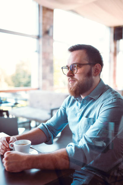 Male Hipster Enjoying First Coffee Of The Day