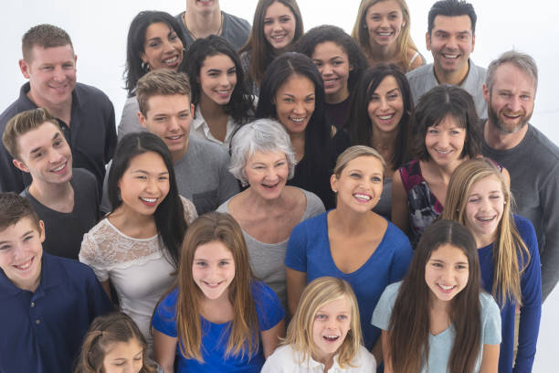 istock Large, diverse group of people gathered indoors 1165596538