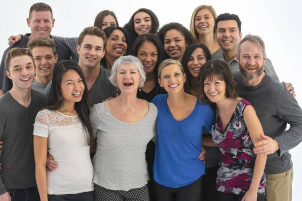 istock Large, diverse group of people gathered indoors 1165596540