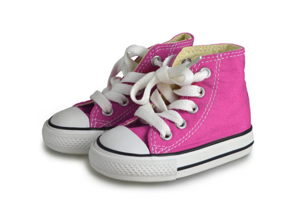 istock Pink baby sneakers isolated on white background 1165596619