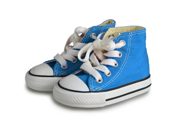 istock Blue baby sneakers isolated on white background 1165598491
