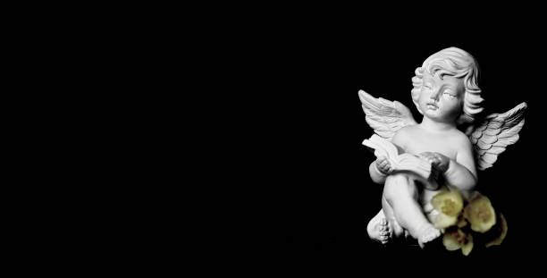 istock Condolence card with guardian angel on black background 1165600634