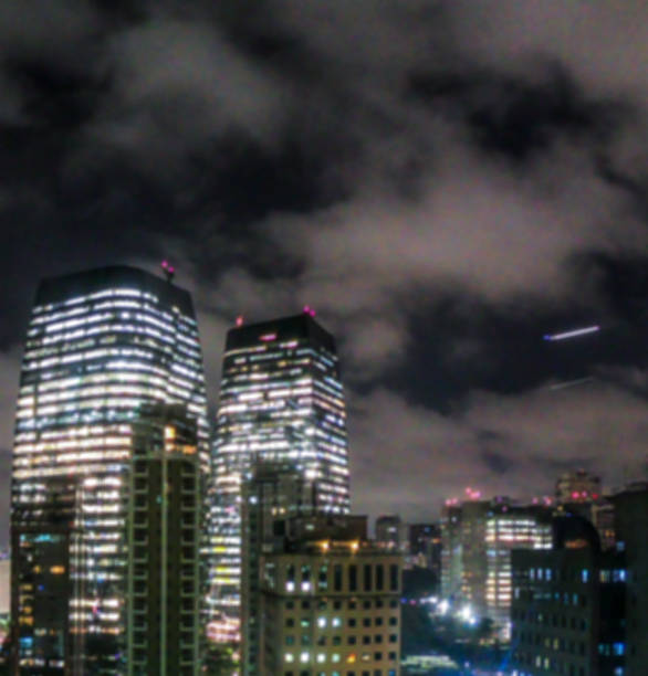 Night bokeh light in big city, abstract blur defocused background