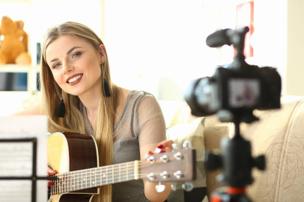 istock Guitar Player Recording Creative Musical Vlog 1165610505