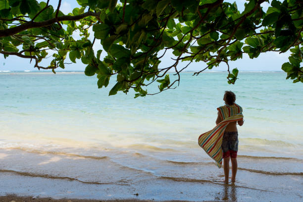istock Splashing and playing in beautiful ocean waters 1165610514