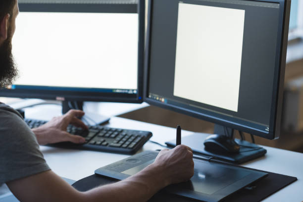 istock web graphic design male artist digital tablet 1165610771