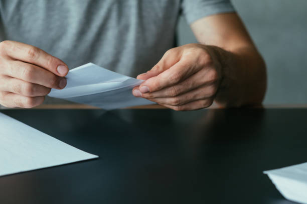 istock resignation notice man formal letter envelope 1165610777