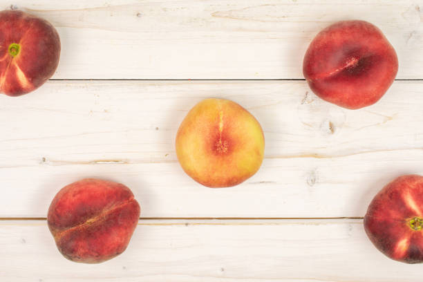 istock Fresh paraguay peach on grey wood 1165612305