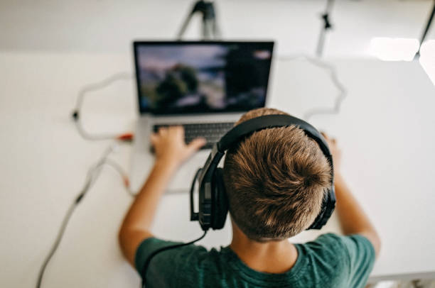 istock Kid recording his gameplay for vlog 1165612965