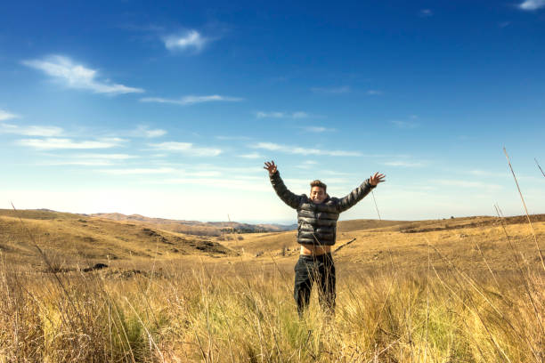 istock Happy young man enjoying nature. Freedom concept. 1165615161