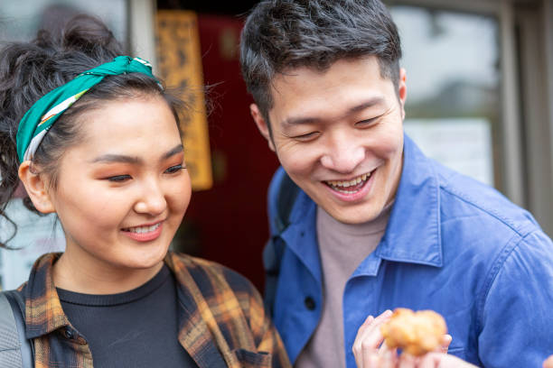 istock Friends Eating Take Away Chicken 1165627151