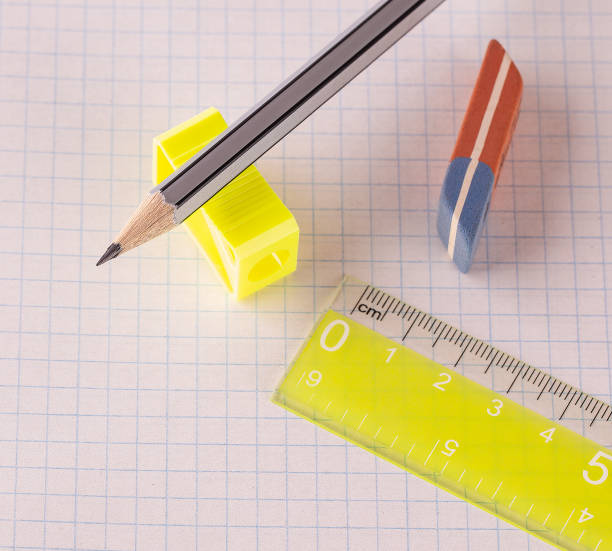 istock The pencils with pencil sharpener and eraser with ruler isolated on white background 1165628539