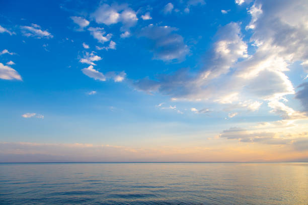 istock sky sunset sea. Beautiful clouds, soft colors. Natural background 1165633969