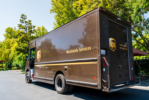 July 22, 2019 Sunnyvale / CA / USA - UPS (United Parcel Service) vehicle making deliveries in South San Francisco Bay area