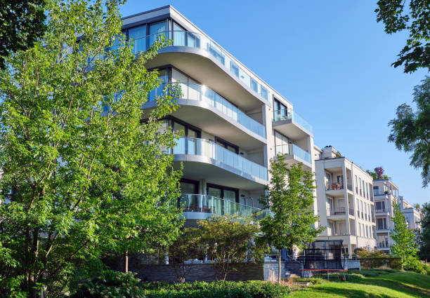 istock Modern apartment house with a green garden 1165639018