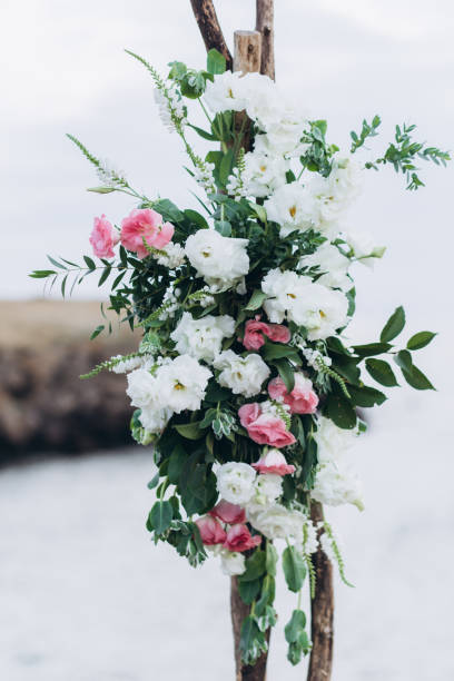 istock Fragment of a wedding arch for an exit ceremony decorated with white and pink flowers. 1165642748