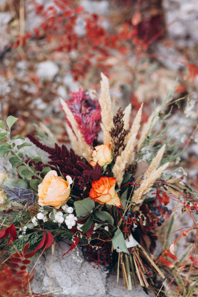 istock Wedding floristry in a yellow autumn meadow. 1165642910