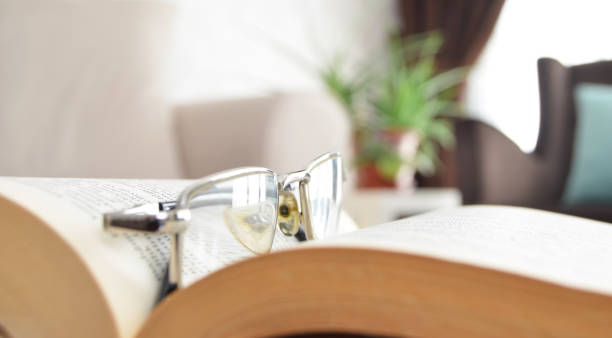 istock book and glasses 1165643007