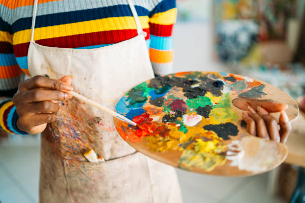istock Female artist working in studio 1165643044