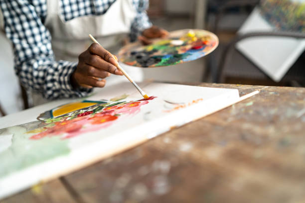 istock Female artist working in studio 1165643051