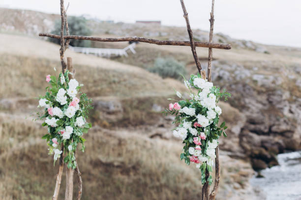 istock Fragment of a wedding arch for an exit ceremony decorated with white and pink flowers. 1165643816