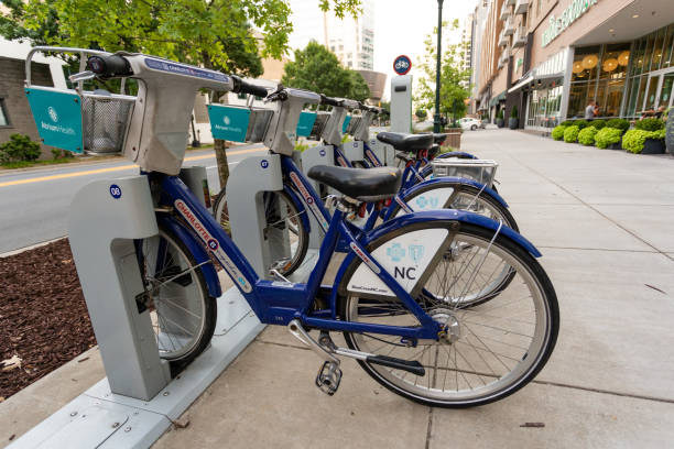 B Line Rental Bicycles parked on a sidewalk in downtown Charlotte. stock photo