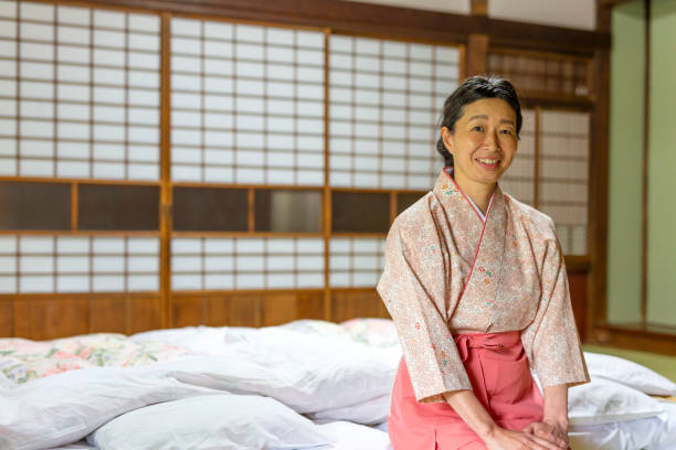 istock Japanese Woman Bowing in a Ryokan 1165648556