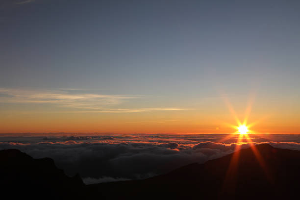 istock Sunrise above Clouds at Haleakala summit 1165651062