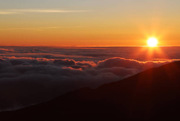 istock Sunrise above Clouds at Haleakala summit 1165651124