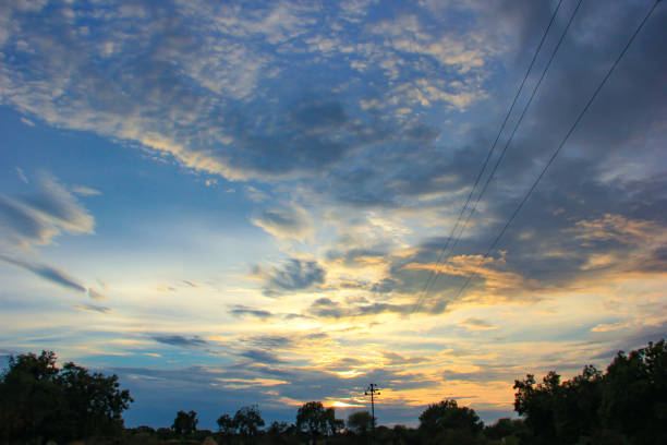 istock Sunset / sunrise with clouds, Panoramic view of a cloudy sky at sunset 1165653466