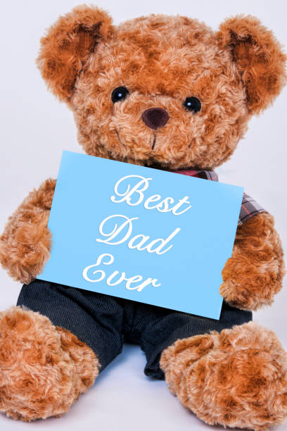 istock Teddy bear holding  blue sign saying Best Dad Ever 1165662852