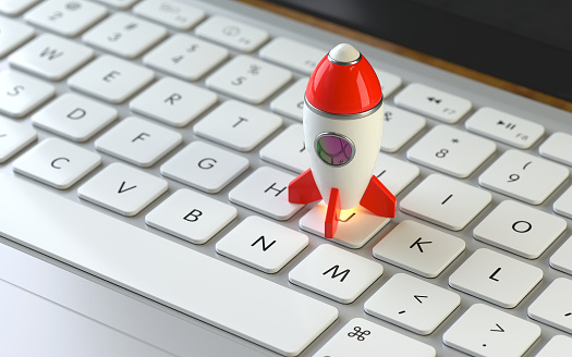 rocket on the keyboard of a latop, 3d rendering,conceptual image. online  success and innovation concepts.