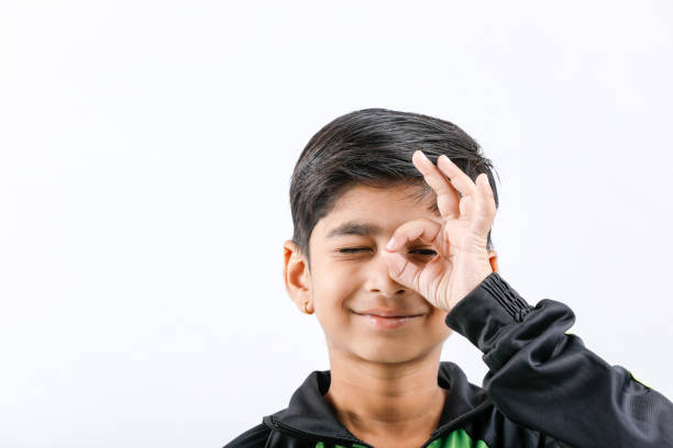 istock Cute Indian little boy playing and giving multiple expression 1165665696