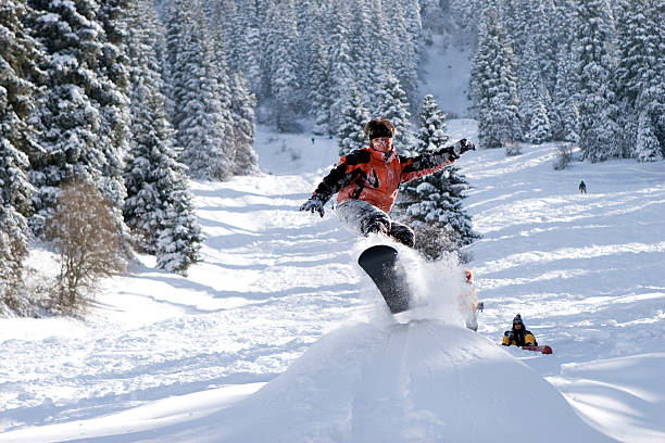 istock Snowboarder pull-up the sweet grab off a jump 116566644