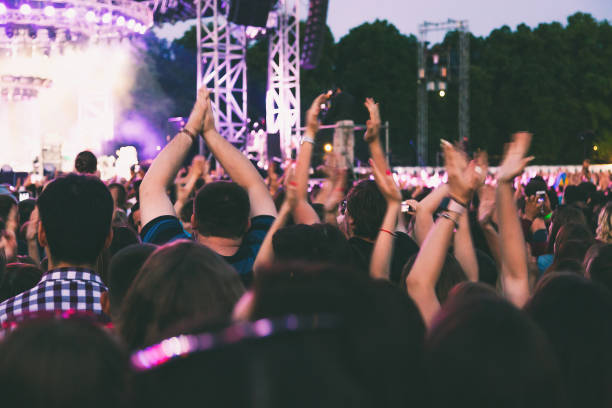istock A big concert crowd having fun in front of the stage. 1165666740