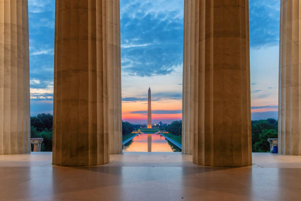 Lincoln Memorial at sunrise in Washington, D.C. Sunrise view at Washington Monument and Reflecting Pool from Lincoln Memorial in Washington, D.C., USA. national monument stock pictures, royalty-free photos & images