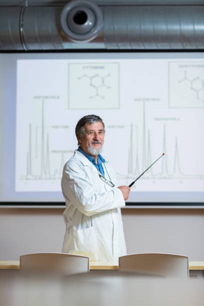 istock Senior chemistry professor giving a lecture 1165670898