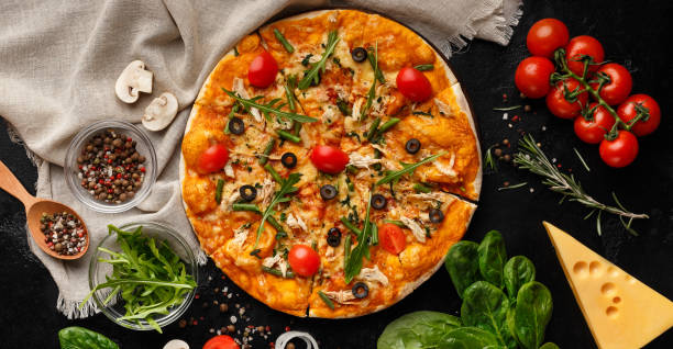 istock Pizza decorated with rocket salad and cherry tomatoes 1165671561